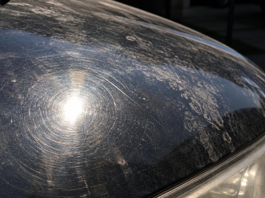 Car paint before detailing with swirl marks and oxidation